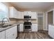 Modern kitchen with granite countertops at 3211 Sandusky Dr, Decatur, GA 30032
