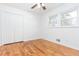 Well-lit bedroom with hardwood floors and double-door closet at 2005 Dobbins Nw Dr, Kennesaw, GA 30144