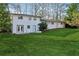Large backyard with lush green lawn and white home at 3048 Charlbury Pl, Avondale Estates, GA 30002