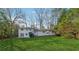 Large backyard with lush green lawn and white home at 3048 Charlbury Pl, Avondale Estates, GA 30002