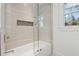 Clean bathroom with a tub and shower, and modern tile at 3048 Charlbury Pl, Avondale Estates, GA 30002
