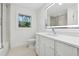 Elegant bathroom with a quartz vanity and frameless shower at 3048 Charlbury Pl, Avondale Estates, GA 30002