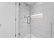 Spa-like shower with marble tile and glass enclosure at 3048 Charlbury Pl, Avondale Estates, GA 30002