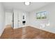 Bright bedroom featuring hardwood floors and an ensuite bathroom at 3048 Charlbury Pl, Avondale Estates, GA 30002