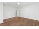 Simple bedroom with hardwood floors and access to the hallway at 3048 Charlbury Pl, Avondale Estates, GA 30002