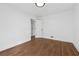 Well-lit bedroom featuring hardwood floors and a closet at 3048 Charlbury Pl, Avondale Estates, GA 30002