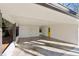 Attached carport with concrete flooring and storage at 3048 Charlbury Pl, Avondale Estates, GA 30002