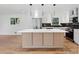 Renovated kitchen featuring white cabinets, quartz countertops, and hardwood floors at 3048 Charlbury Pl, Avondale Estates, GA 30002