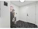 Clean laundry room with new flooring, water heater, and door at 3048 Charlbury Pl, Avondale Estates, GA 30002
