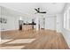 Open concept living room with hardwood floors and kitchen at 3048 Charlbury Pl, Avondale Estates, GA 30002