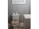 Clean bathroom with toilet and tan toilet cover at 1336 Diamond Se Ave, Atlanta, GA 30316