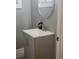 Modern bathroom with gray vanity and round mirror at 1336 Diamond Se Ave, Atlanta, GA 30316