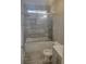 Modern bathroom with tub, shower, and gray tile at 1336 Diamond Se Ave, Atlanta, GA 30316