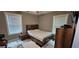 Cozy bedroom with a double bed, nightstand and window blinds at 1336 Diamond Se Ave, Atlanta, GA 30316