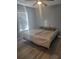 Spacious bedroom with large bed, ceiling fan, and window blinds at 1336 Diamond Se Ave, Atlanta, GA 30316
