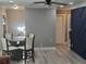 Dining area with glass table and four chairs, next to a navy blue accent wall at 1336 Diamond Se Ave, Atlanta, GA 30316
