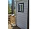 Gray siding exterior with wooden deck and window at 1336 Diamond Se Ave, Atlanta, GA 30316