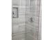 Shower with glass door and gray tile surround at 1336 Diamond Se Ave, Atlanta, GA 30316