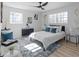 Main bedroom with a king-size bed and a blue and white color scheme at 2233 Troutdale Dr, Decatur, GA 30032