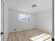 Bright bedroom with light flooring and large window at 2233 Troutdale Dr, Decatur, GA 30032