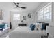 Main bedroom with king bed, light walls, and a ceiling fan at 2233 Troutdale Dr, Decatur, GA 30032