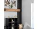 Modern built-in shelving with black cube organizers and wooden mantel at 2233 Troutdale Dr, Decatur, GA 30032