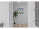 Bright entryway with hardwood floors and modern art at 2233 Troutdale Dr, Decatur, GA 30032