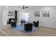 Living room with fireplace, black armchairs, and hardwood floors at 2233 Troutdale Dr, Decatur, GA 30032