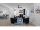 Living room with fireplace, black armchairs, and hardwood floors at 2233 Troutdale Dr, Decatur, GA 30032