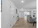 Open living space with hardwood floors and gray sofa at 2233 Troutdale Dr, Decatur, GA 30032