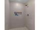 Large walk-in shower with gray tile and built-in shelf at 2233 Troutdale Dr, Decatur, GA 30032
