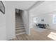 Modern staircase leading to a bright and airy basement at 2233 Troutdale Dr, Decatur, GA 30032