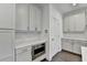 White shaker cabinets, quartz countertops and built-in microwave at 3528 Myron Pl, Suwanee, GA 30024