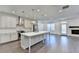 Open concept kitchen with island, stainless steel appliances, and hardwood floors at 3528 Myron Pl, Suwanee, GA 30024