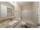 Updated bathroom with granite vanity, marble tile shower/tub combo at 4424 Malibu Dr, Decatur, GA 30035