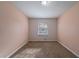 Spacious bedroom with neutral walls and carpet flooring at 4424 Malibu Dr, Decatur, GA 30035