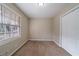 Well-lit bedroom with carpet, window, and closet at 4424 Malibu Dr, Decatur, GA 30035