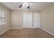 Spacious bedroom with ceiling fan, carpet, and large closet at 4424 Malibu Dr, Decatur, GA 30035