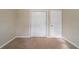 Simple bedroom with carpet flooring and double closet at 4424 Malibu Dr, Decatur, GA 30035