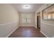 Bright dining area with wood-look floors and view to living room at 4424 Malibu Dr, Decatur, GA 30035