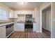 Modern kitchen featuring granite countertops and stainless steel appliances at 4424 Malibu Dr, Decatur, GA 30035