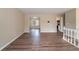 Open living room with hardwood floors and view into kitchen at 4424 Malibu Dr, Decatur, GA 30035