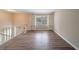 Spacious living room with built-in shelving and hardwood floors at 4424 Malibu Dr, Decatur, GA 30035