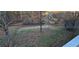 Large backyard with fenced area, trampoline, and mature trees at 710 Seals Rd, Dallas, GA 30157