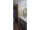 Bathroom with single vanity, toilet and wood-look floors at 710 Seals Rd, Dallas, GA 30157