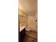 Bathroom with a tub, toilet, vanity, and vinyl flooring at 710 Seals Rd, Dallas, GA 30157