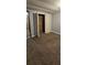 Bedroom with a double door closet and brown carpet at 710 Seals Rd, Dallas, GA 30157