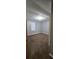 Bright bedroom featuring brown carpet and a window at 710 Seals Rd, Dallas, GA 30157