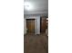 Bedroom with double door closet and brown carpet at 710 Seals Rd, Dallas, GA 30157