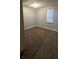 Spacious bedroom with brown carpet and a window at 710 Seals Rd, Dallas, GA 30157